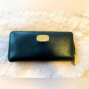 Black pebble leather Michael Kors wallet with gold hardware